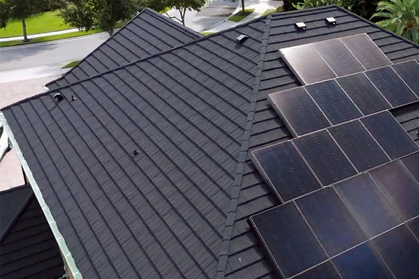 A sustainable metal roof with solar panels installed by Noland’s Roofing, showcasing eco-friendly roofing materials and energy-efficient solutions for Central Florida homes.