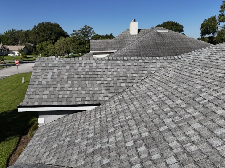 aerial view of a shingle roof with gray shingles after a reroof by Noland's Roofing in Deltona